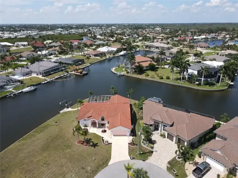 Aerial view of canal homes and seawalls in Punta Gorda, Florida