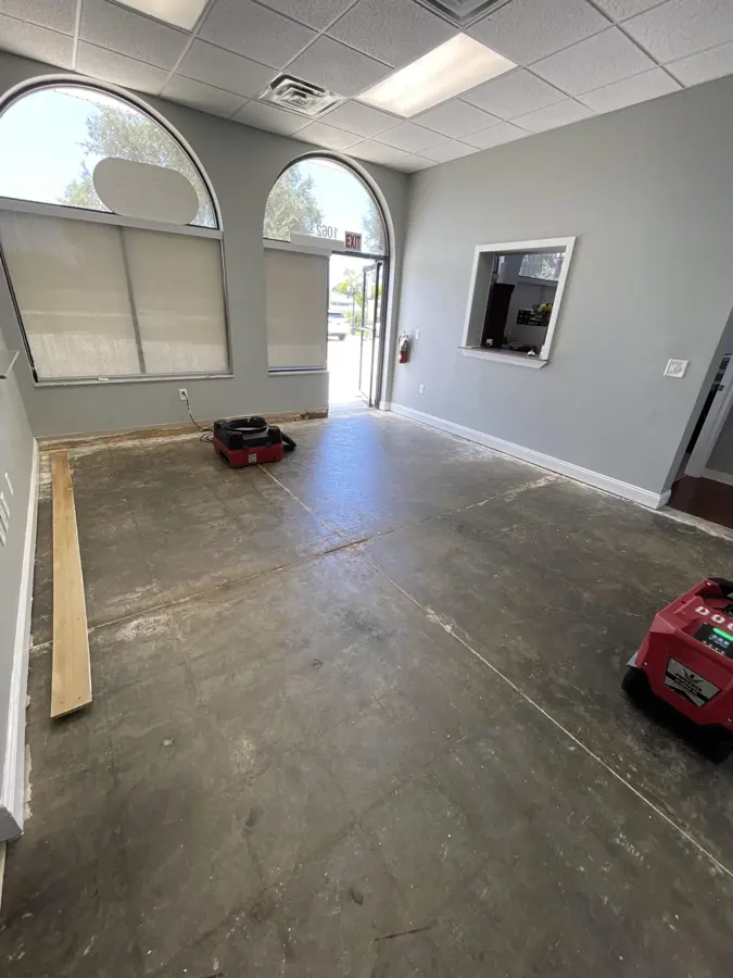 Office suite with arched windows stripped to the slab for drying in Punta Gorda, FL
