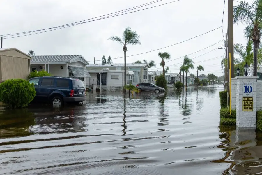 Floodwater filling the street of a Florida manufactured-home community after a storm